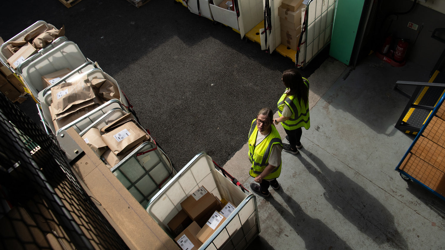 Team Members at Entrance of Warehouse Location 2, with Parcels awaiting Courier Collection