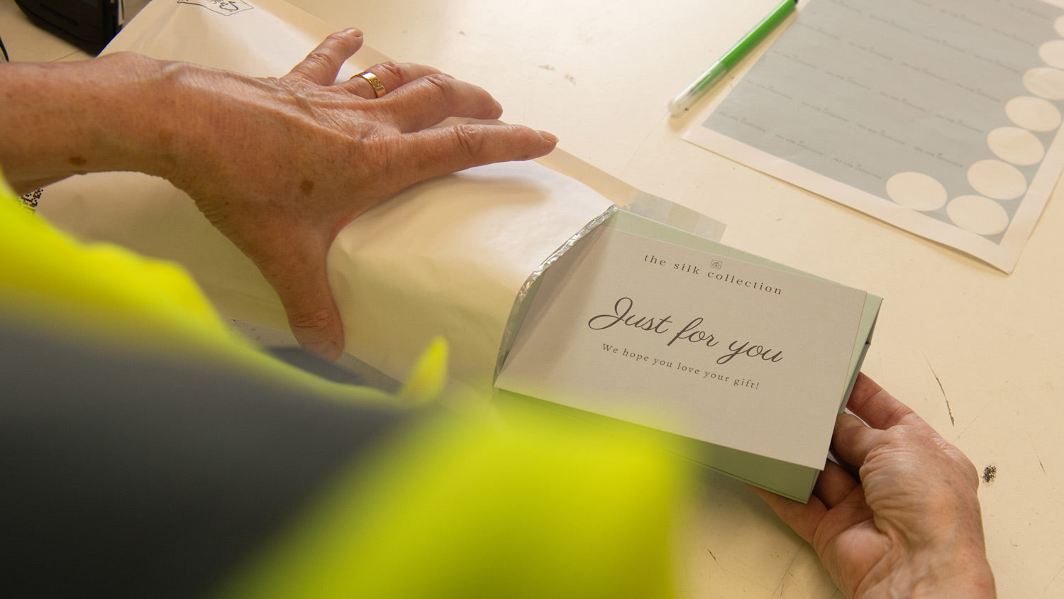 Team Member Packing an Order with Care