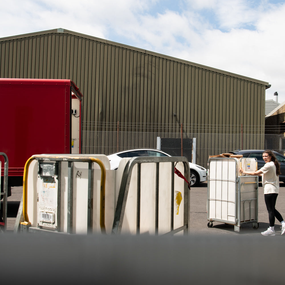 Team Member Waiting to Load a  Parcel Cage onto a Royal Mail Truck