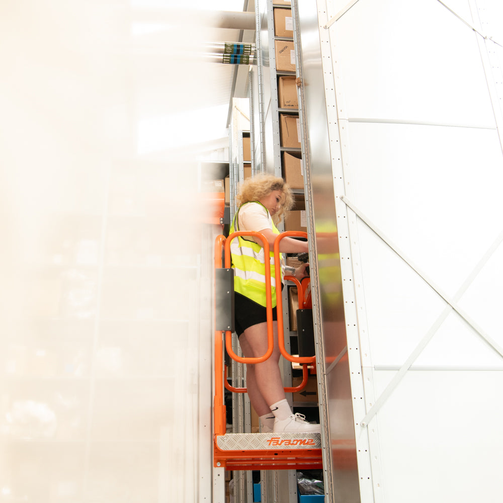 Team Member on a Faraone Lifting Machine in the Warehouse