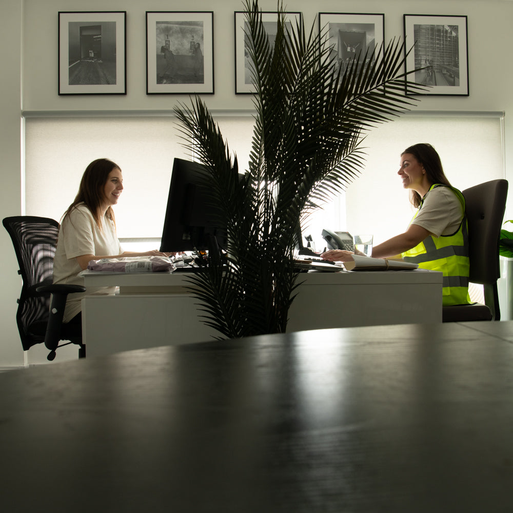 Team Members Working on Wholesale Partners Automated Services in the Office